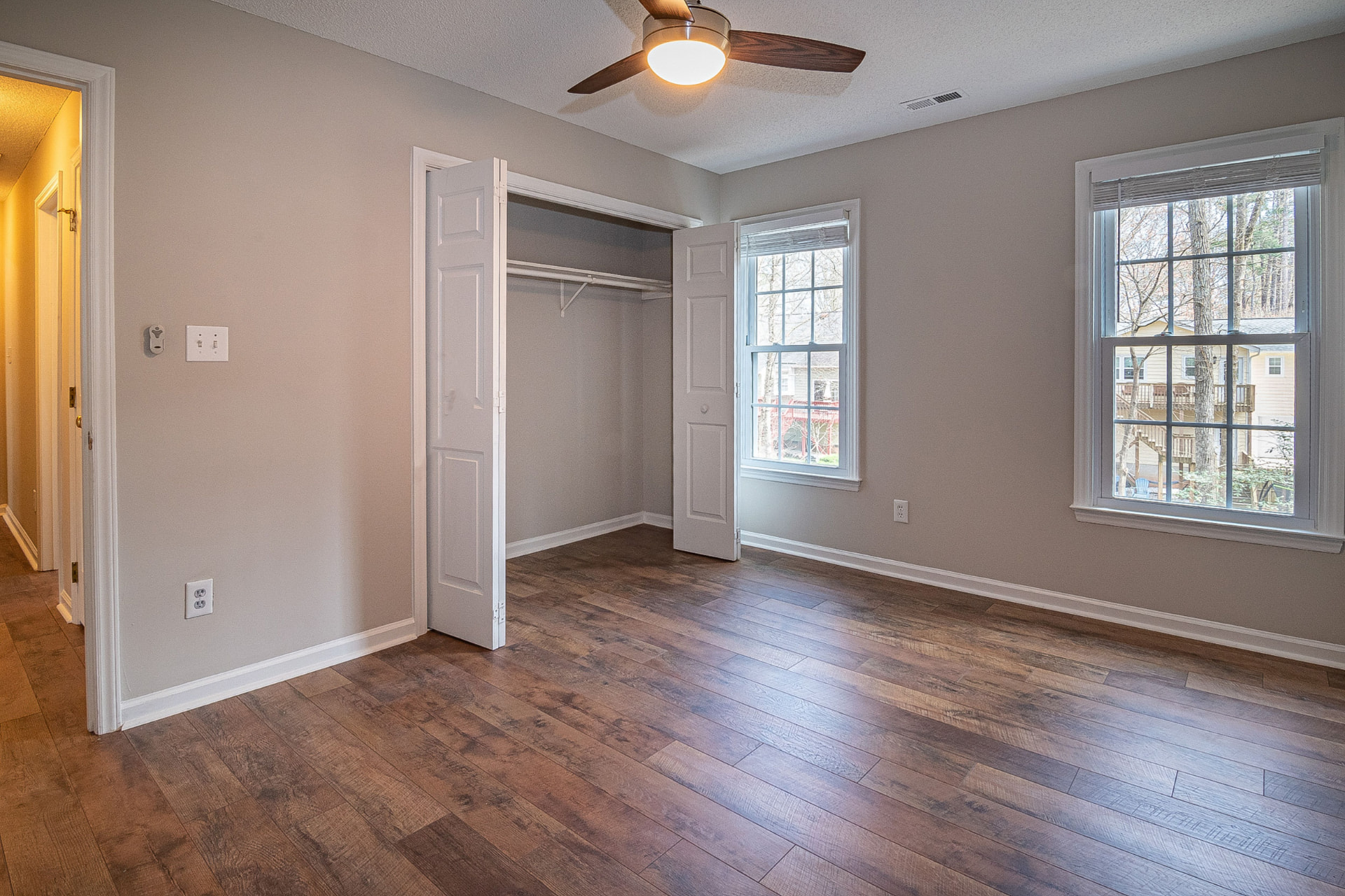 Empty bedroom with fresh floors after a move-out cleaning in a west-side Cleveland home