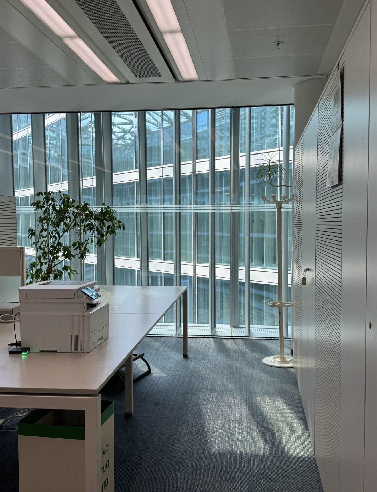 Clean, bright office interior with glass walls and tidy workspaces on Cleveland's west side
